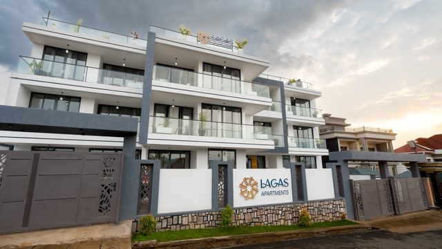 Lagas Apartments at golden hour, the building facade bathed in warm sunset light